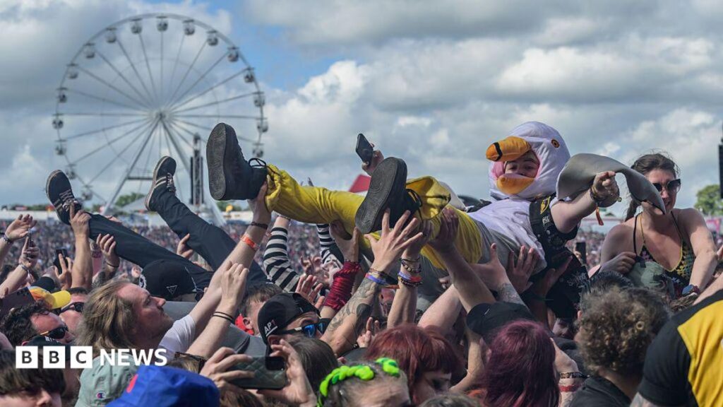 Download festival 2026 mayhem in 13 photos An illustration showing a pair of couple going live on their social media channel, who are surrounded by sad-looking young people handing their hearts and some flowers to the influencers
