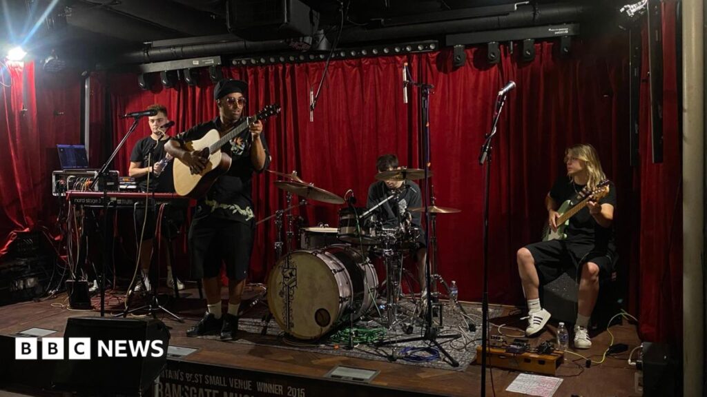 A band soundchecking on stage.