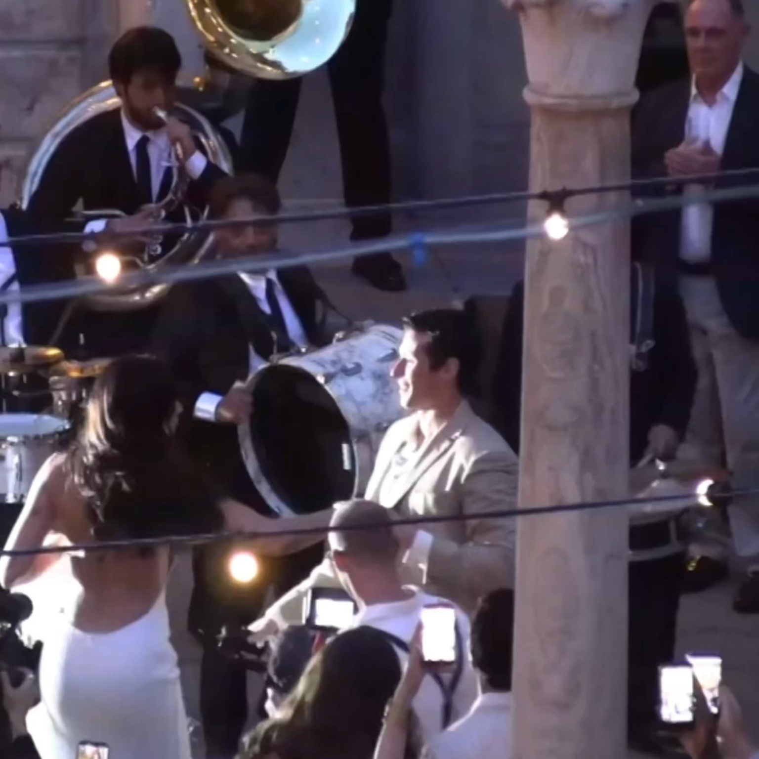 Dua Lipa and Callum Turner dancing at their wedding welcome party in Sicily, Italy.