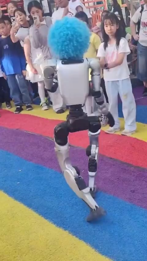 A robot wearing a clown wig in China is going viral after it kicked a child in the stomach.