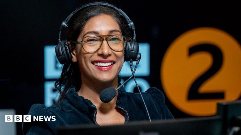 Tina Daheley in the studio, with the BBC Radio 2 logo in the background