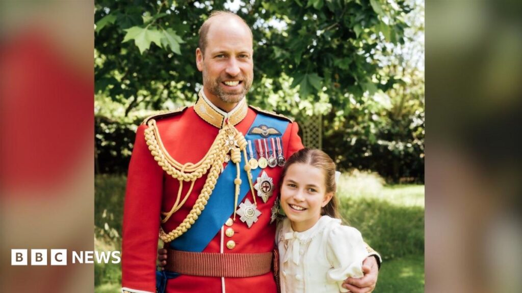 William marks 44th birthday as royals celebrate Father’s Day Prince William is wearing the scarlet dress uniform of the Welsh Guards, of which he is colonel, and has his arm around Charlotte, who is wearing a cream dress.