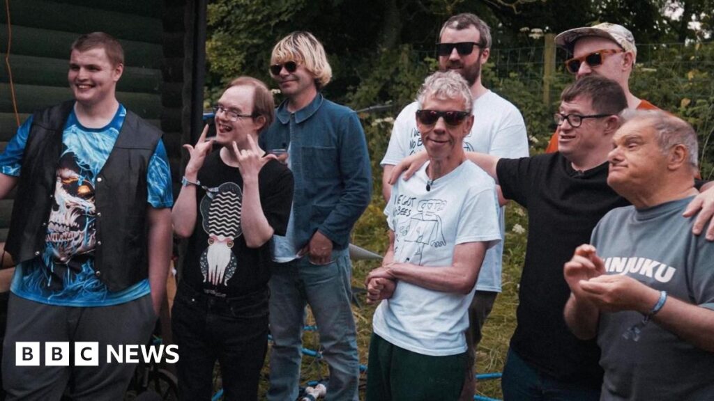 Leeds disability rock band Ultimate Thunder focus of documentary A mixed age group of men, some with disabilities, stand alongside each other smiling.