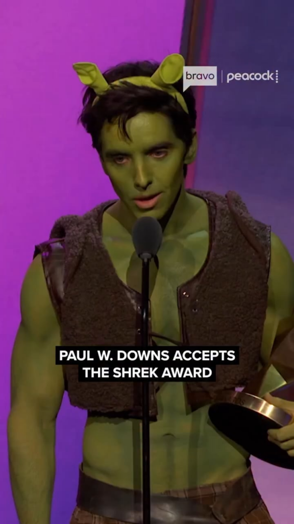 Paul W. Downs accepts the Shrek Award at the Las Culturistas Culture Awards 2026 on June 17th