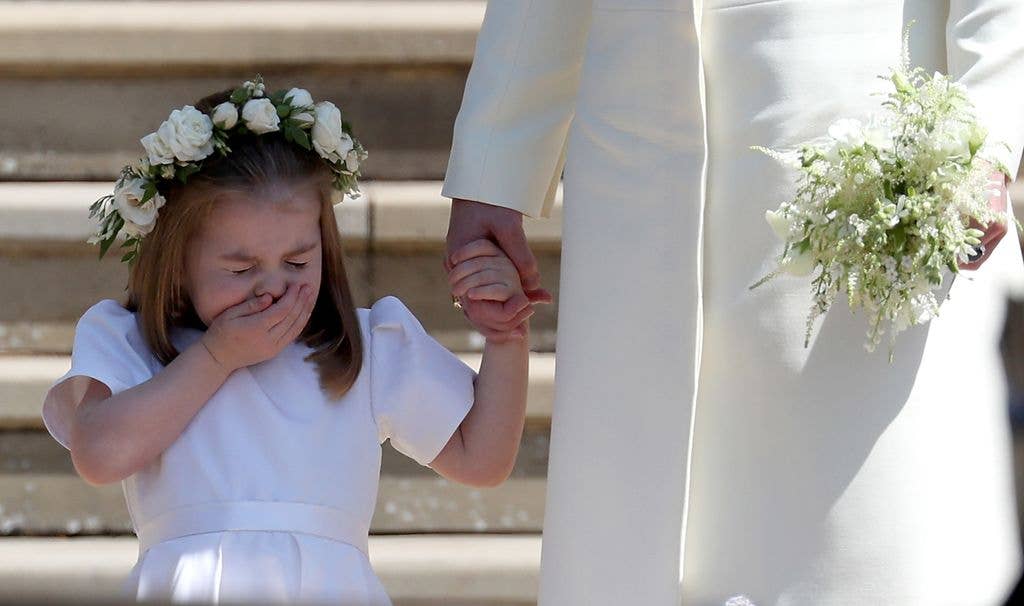 Princess Charlotte of Cambridge stands on the steps with her mother on the day of Prince Harry and Meghan Markle's wedding