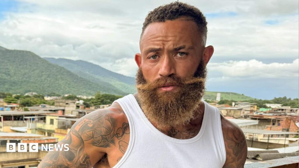 Ashley Cain says he’s ‘not proud’ of sexist language in first comments since show pulled A bearded Ashley Cain looking directly into the camera while filming his BBC documentary series in Rio de Janeiro