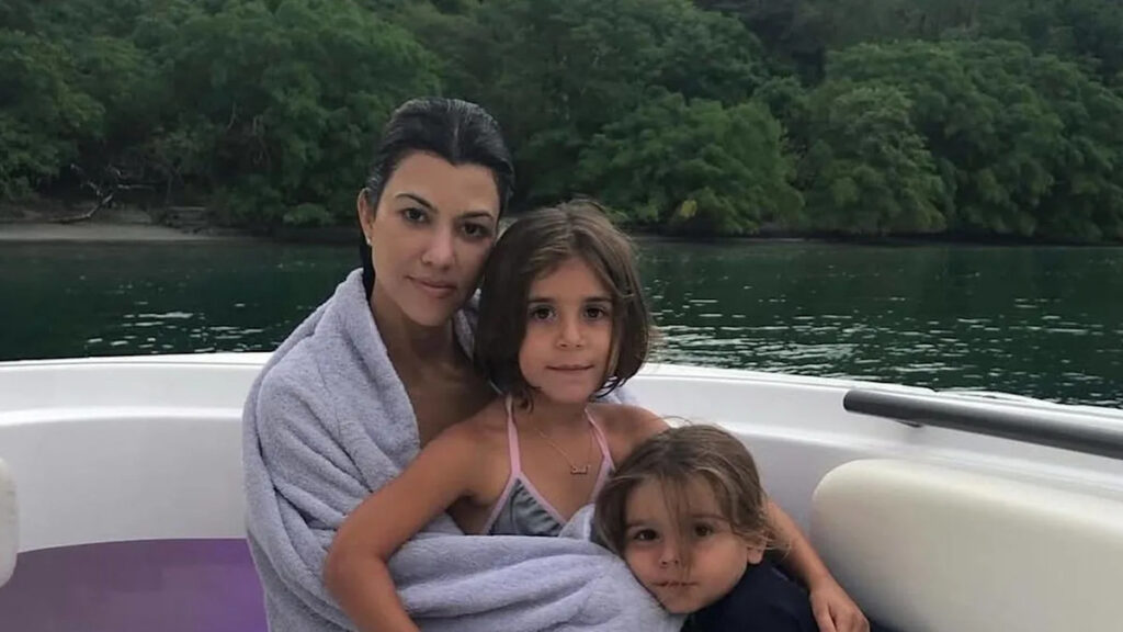 Kourtney Kardashian turns heads in beach photo with new family update
