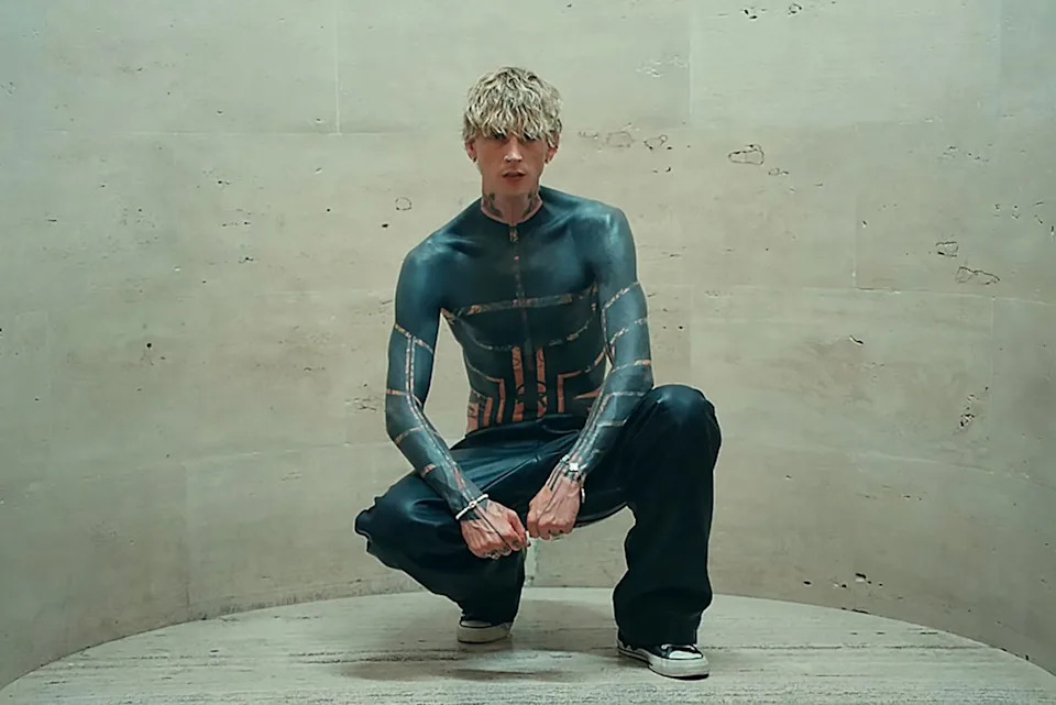 MGK posing with his blackout tattooCredit: Machine Gun Kelly/Youtube