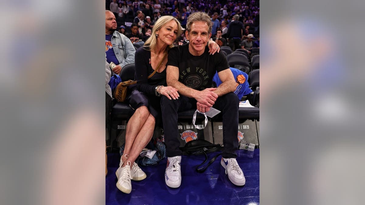 Ben Stiller and Christine Taylor posing together at Madison Square Garden during NBA Finals game