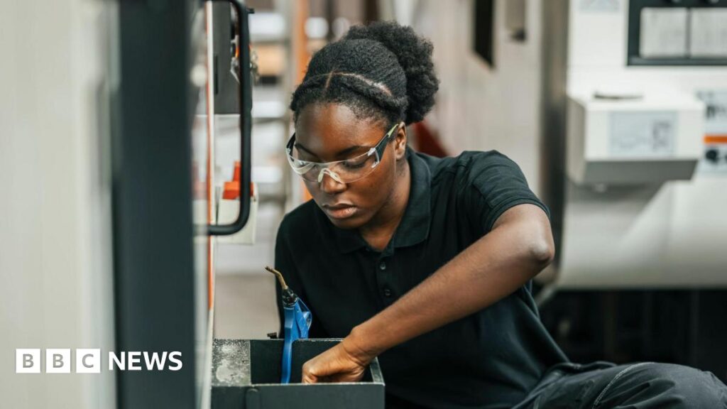 You may be saving for your pension without realising it. Here’s how to check Concentrated young female worker examining mechanics while working in factory.
