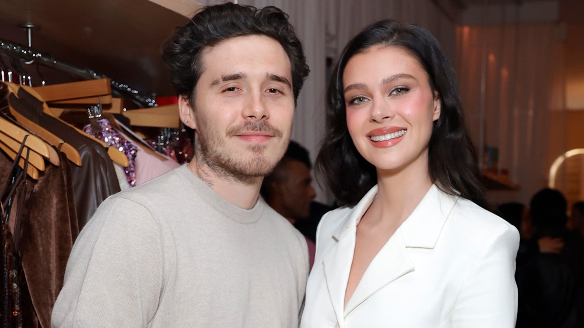 Brooklyn Beckham and Nicola Peltz standing together at an event in Los Angeles