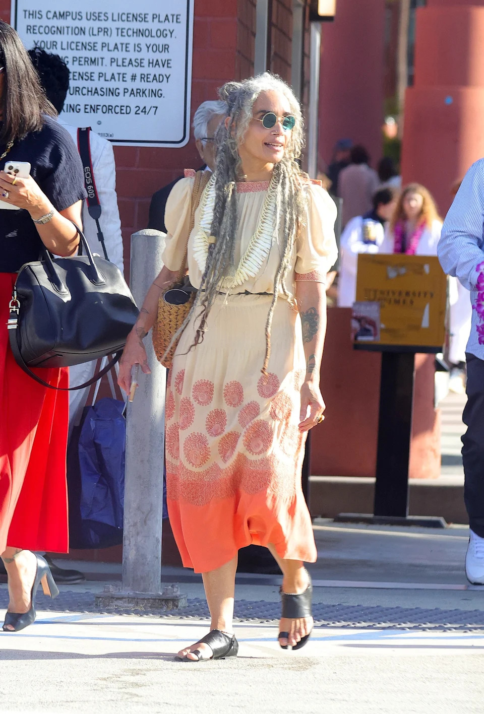 Bonet accessorized with a straw bag, circular sunglasses and sandals. Dsanchez/CPR / BACKGRID