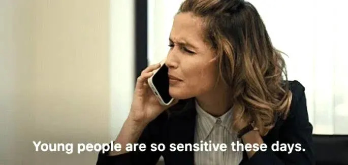 Woman on phone looks puzzled; subtitle reads, "Young people are so sensitive these days."