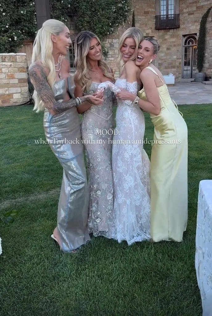 Christina and her friends hugging the bride, wearing bridesmaids dresses
