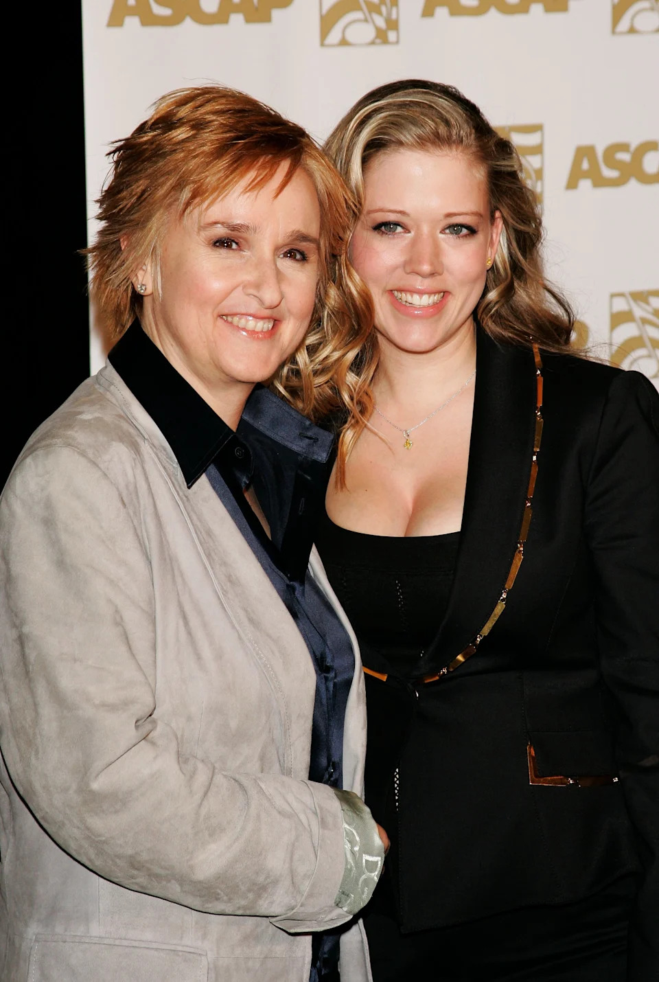 Two individuals posing together at an ASCAP event. One wears a blazer over a shirt, and the other is in a stylish jacket over a top