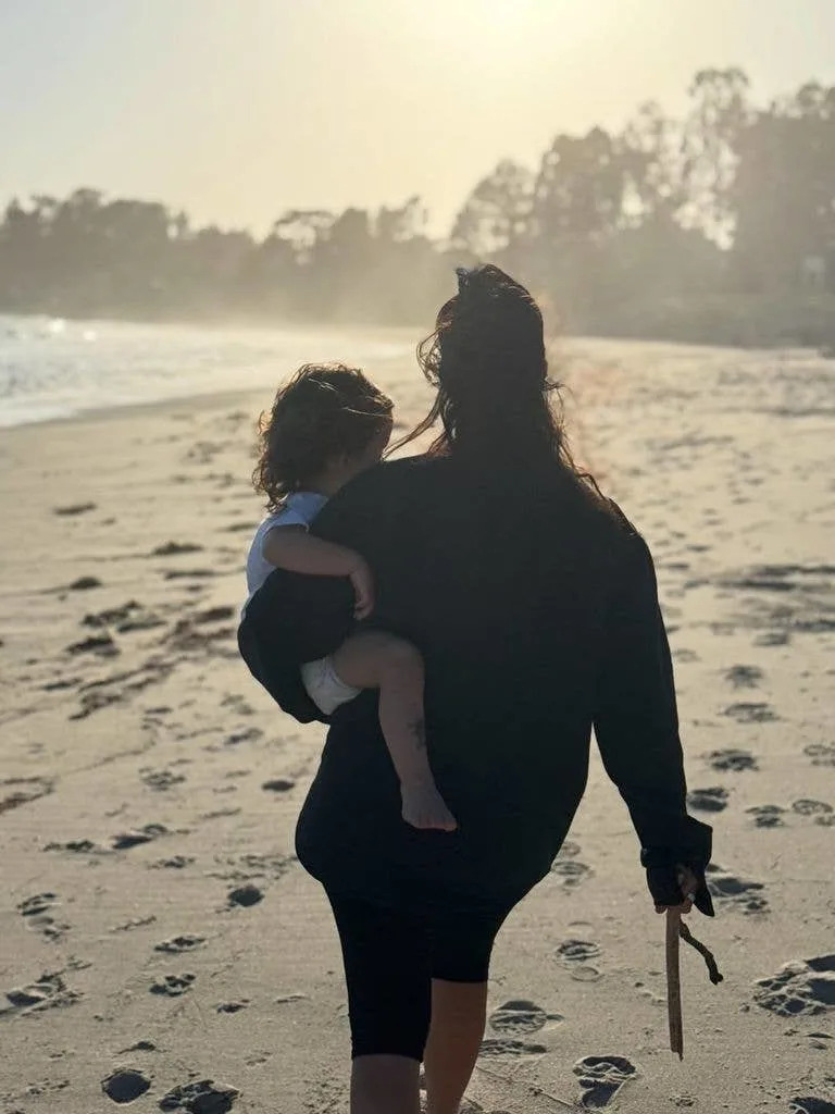 Kourtney Kardashian and her son Rocky walking on the beach, shared via Instagram