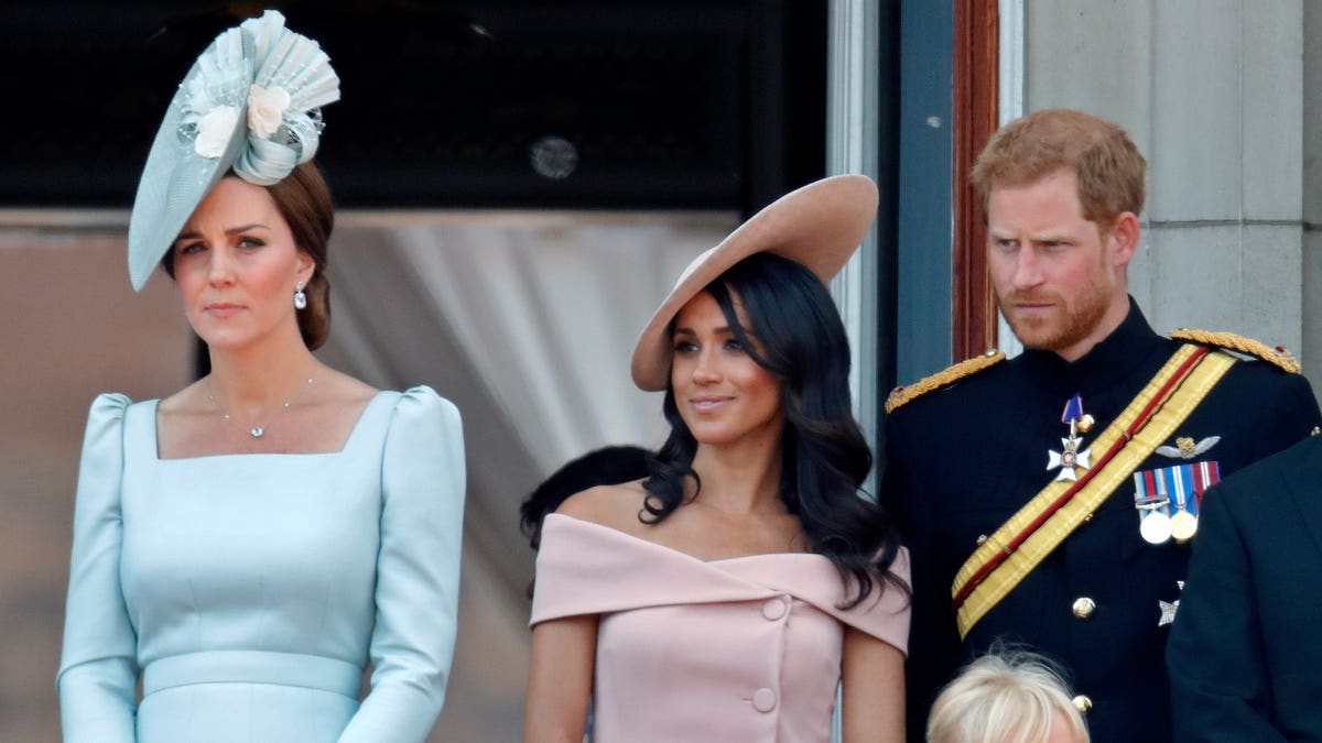 Catherine Duchess of Cambridge Meghan Duchess of Sussex Prince Harry Duke of Sussex and Isla Phillips standing on Buckingham Palace balcony.