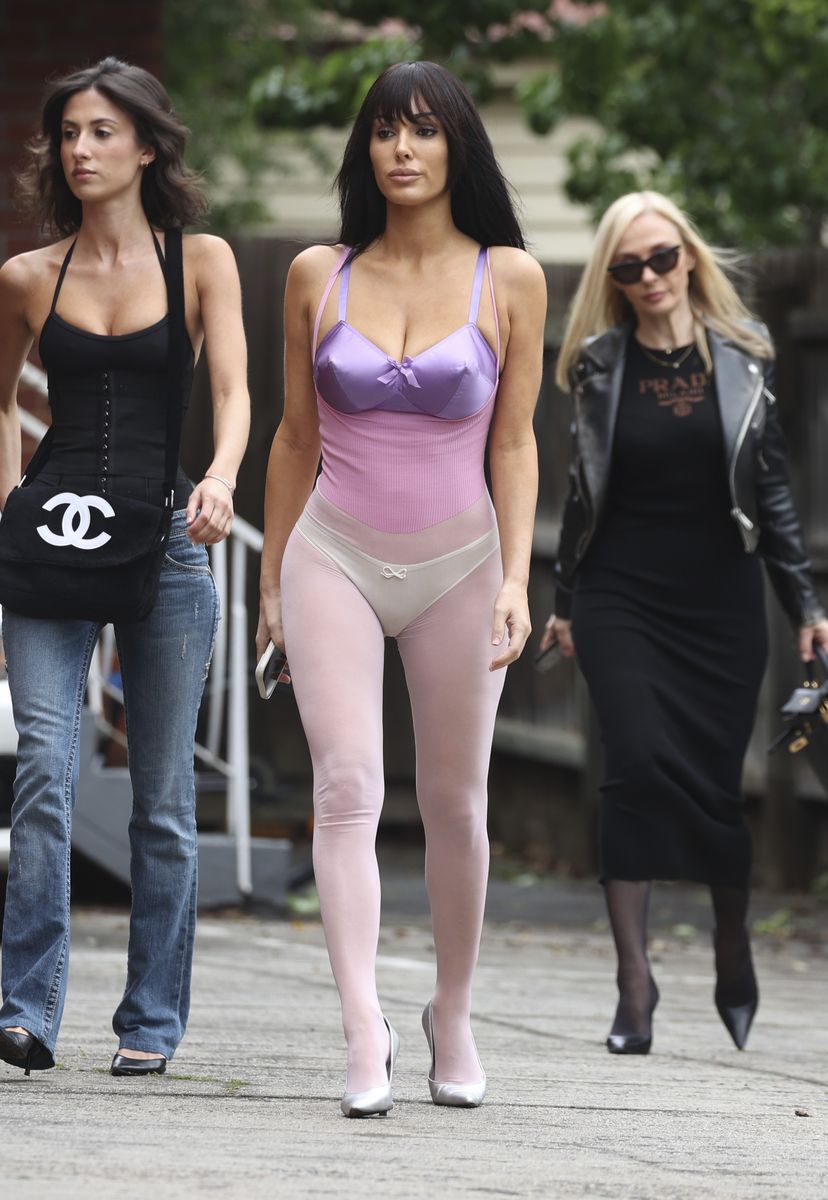 Bianca Censori steps out in satin bustier top and sheer pink tights with mom and sister during Melbourne outing