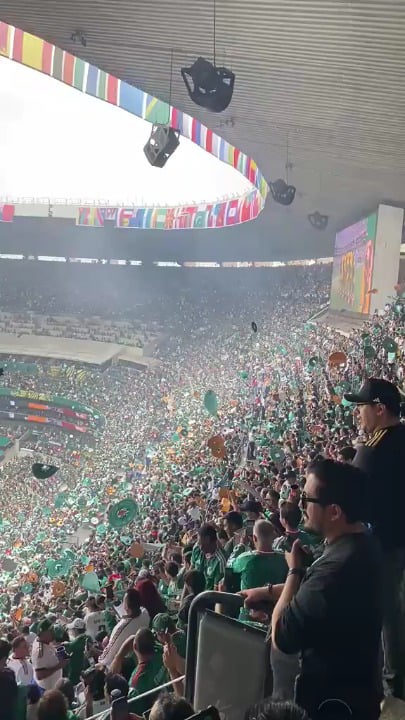 "Mexican fans throwing their sombrero hats into the air at Estadio Azteca before the World Cup match."