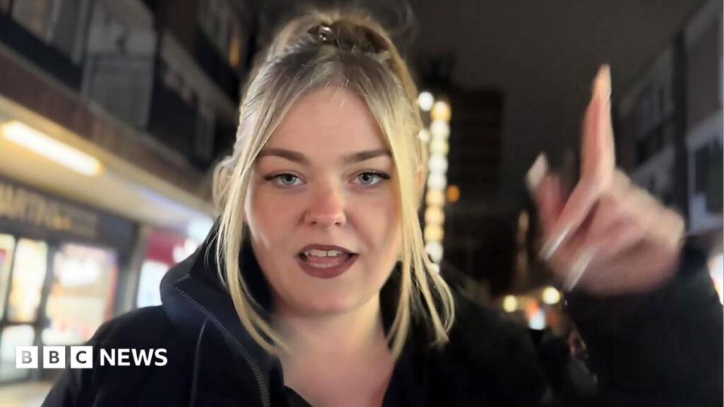 Linkin Park: UK rapper thanks Mike Shinoda for changing her life Morgan Da Savage has blonde long hair and is wearing a black top. She has her fingers up in a "gunfinger" position and smiles into the camera as she performs her rap in the Steeze Factory in front of a group of other people.