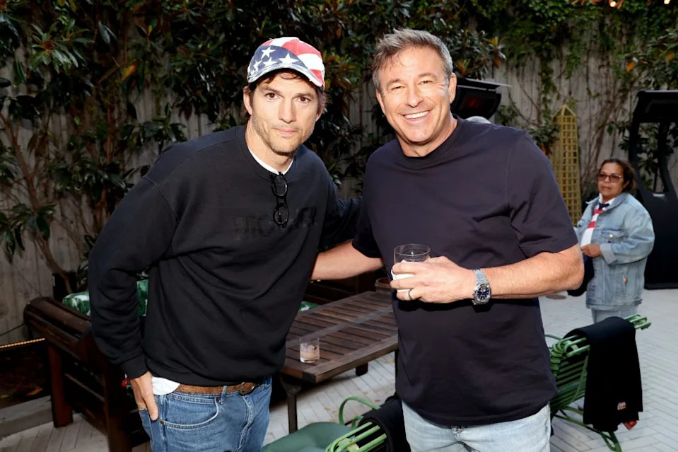Ashton Kutcher and Todd Graves attend a celebrity party hosted by Todd Graves, Owner & Founder of Raising Cane’s, at Lumiere in Los Angeles at Lumiere Brasserie Restaurant on June 25. Getty Images for Raising Cane's
