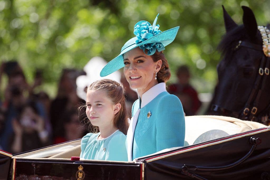 Kate Middleton and Princess Charlotte riding in carriage