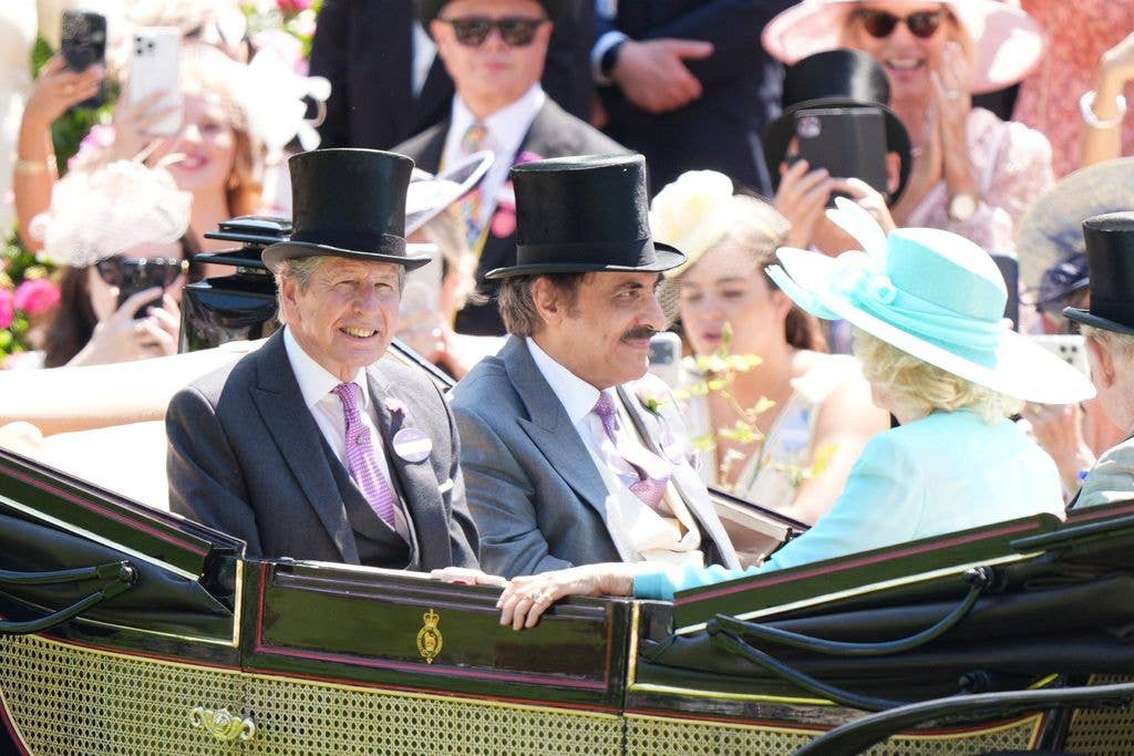 John Warren, the late Queen's beloved racing manager was also in the first carriage