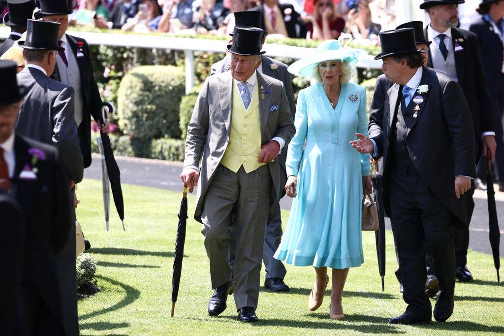 Britain's King Charles III and Britain's Queen Camilla arrive on the fourth day of the Royal Ascot horse racing meeting in Ascot