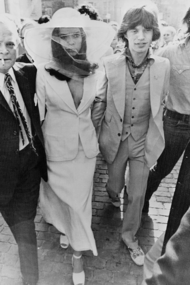 In May 1971, Bianca Jagger wed British rock star Mick Jagger at St Tropez Town Hall in a Yves Saint Laurent skirt suit that offered a new vision of bridal style.