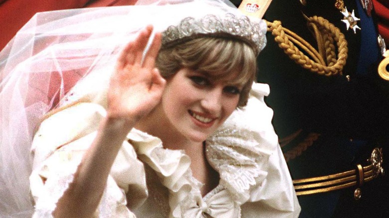 Princess Diana waves to the crowd at her wedding.