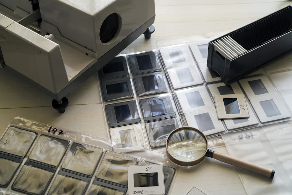 Vintage slide projector and film slides, evoking Kate Middleton's early love of photography