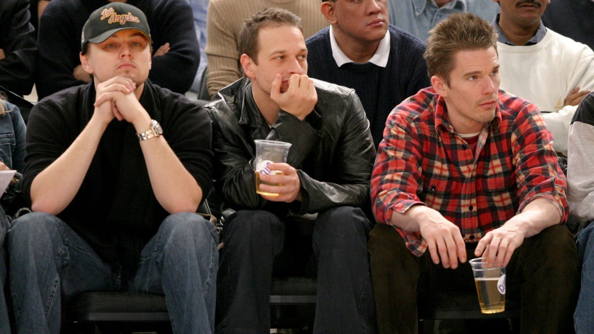 Leonardo DiCaprio, Josh Charles and Ethan Hawke sitting courtside at a Knicks game in 2004