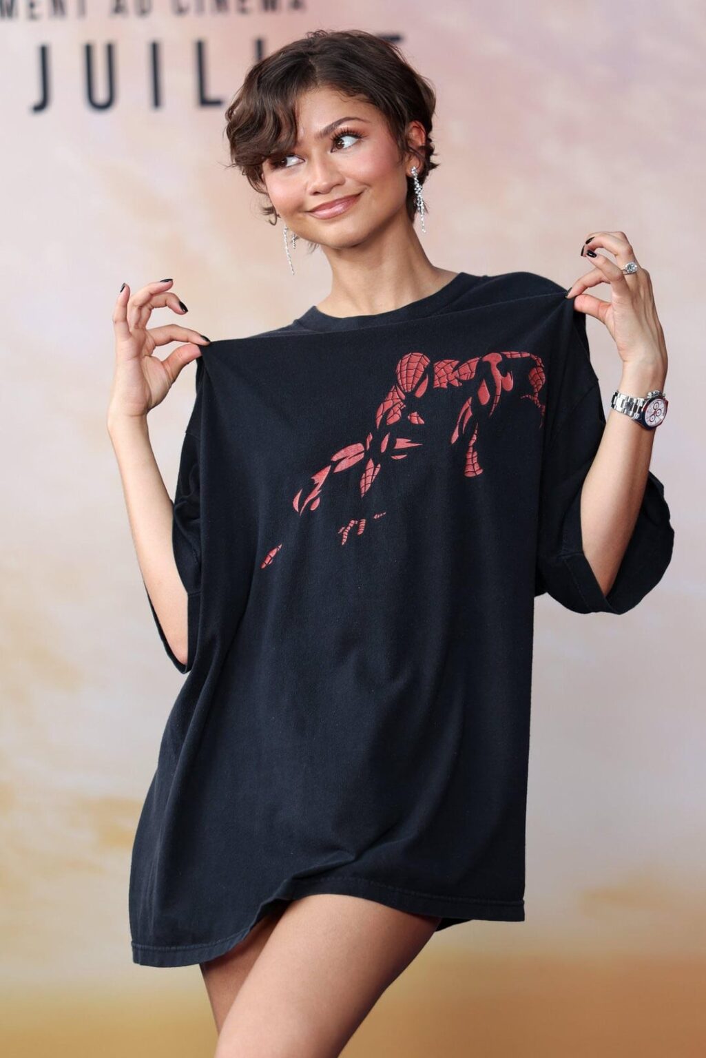 Zendaya at the photo call of "Spider-Man: Brand New Day" in Paris wearing a shirt bought from eBay ($34.99) (June 24, 2026)