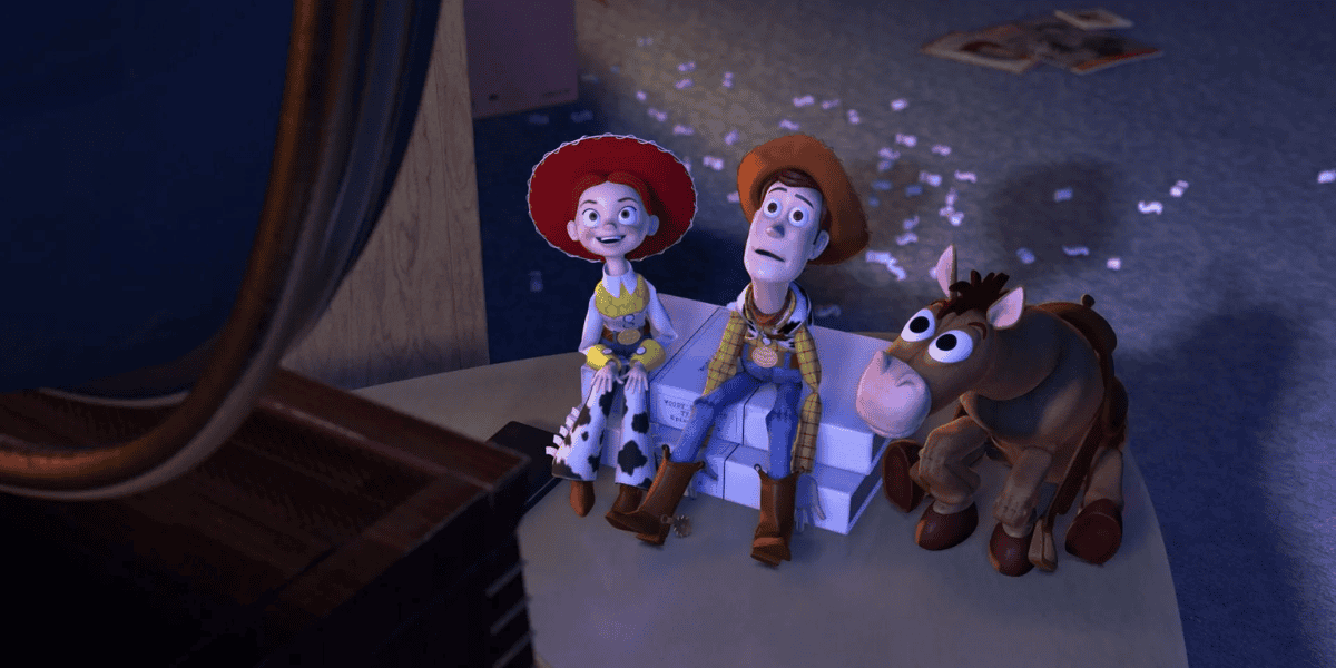 Animated characters Jessie, Woody, and Bullseye from 'Toy Story 2' appear surprised in a dimly lit room with scattered paper and pink petals on the floor.