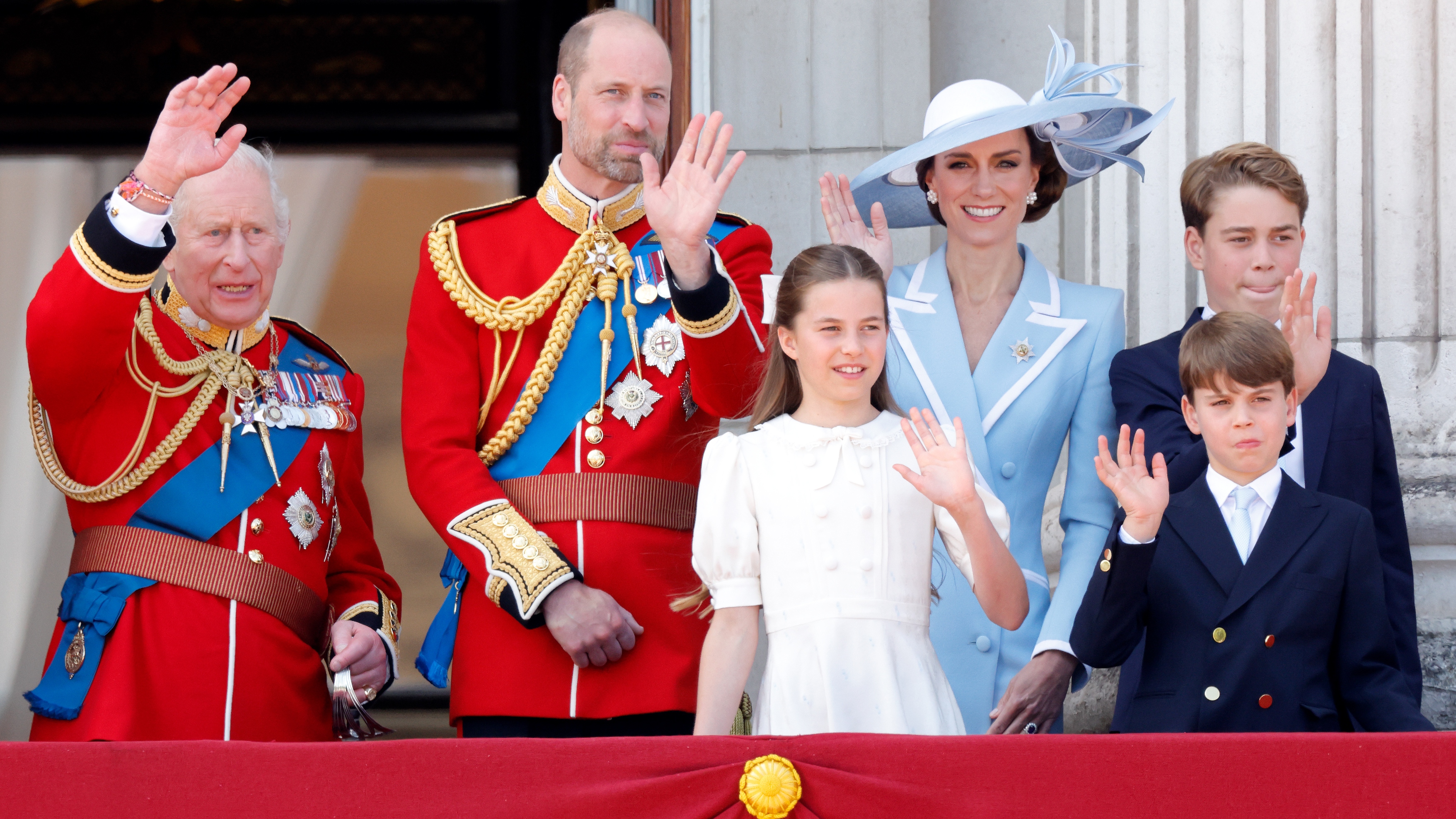King Charles, Prince William, Catherine, Princess of Wales, Princess Charlotte, Prince George and Prince Louis watch a flypast from Buckingham Palace after attending Trooping The Colour 2026