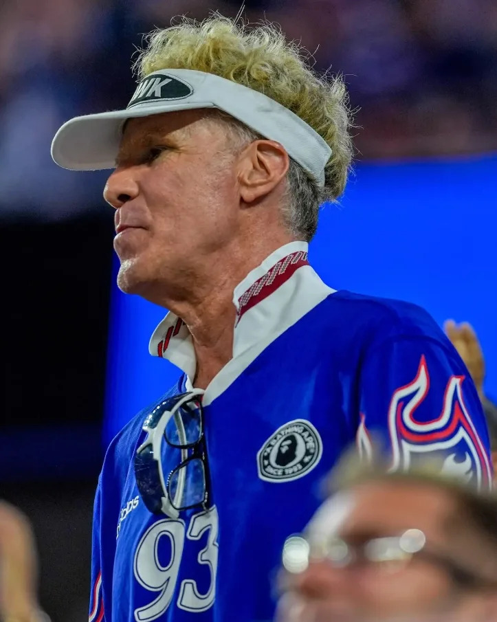 Will Ferrell wore a blue Team USA jersey with a white visor for the World Cup match.