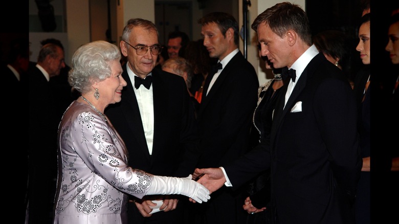Queen Elizabeth II shaking Daniel Craig's hand at the Casino Royal premiere in 2006