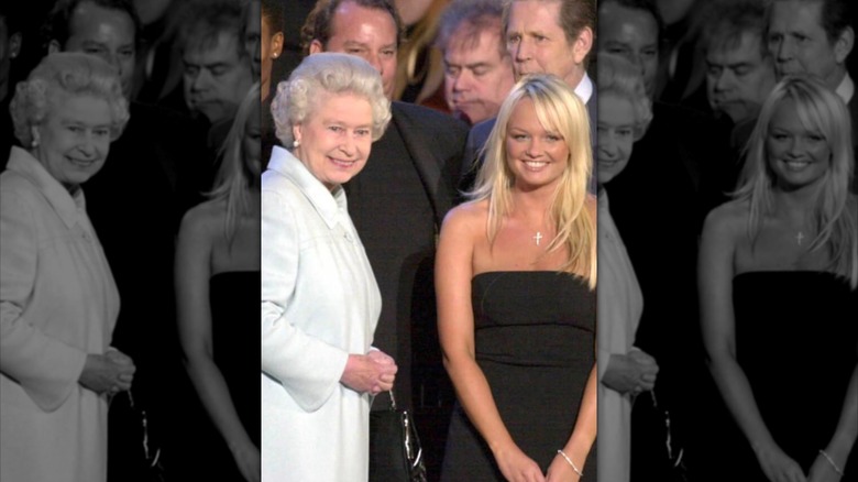 The Queen passes Spice Girl Emma Bunton on stage during 