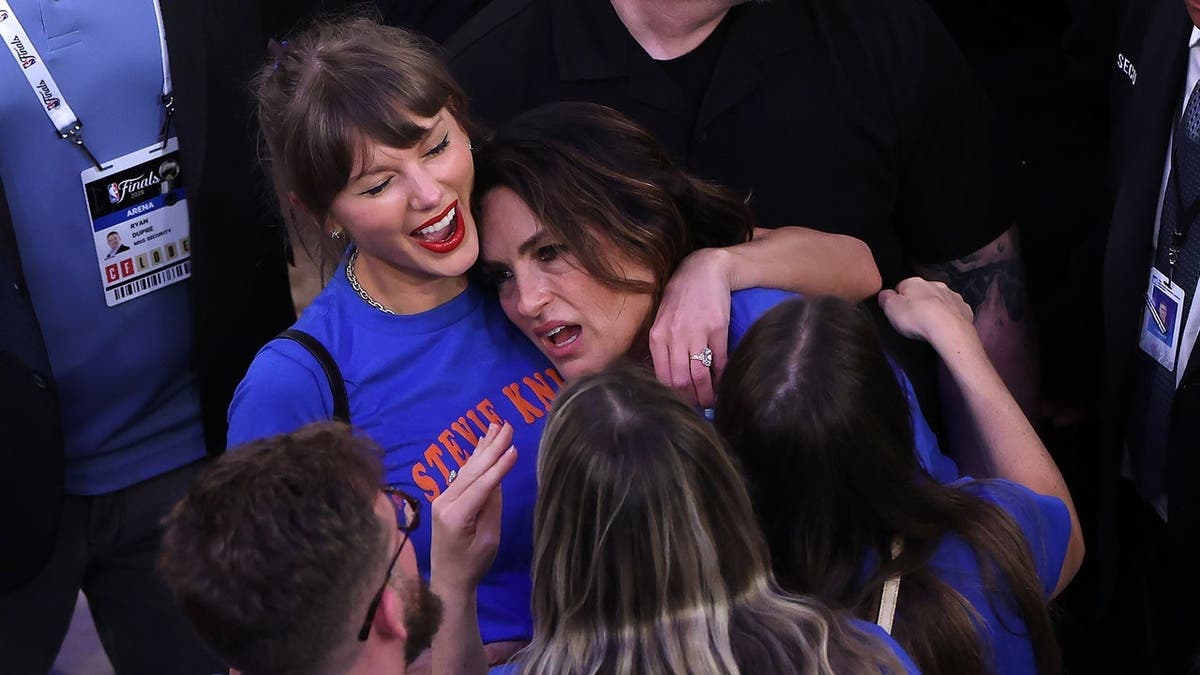 Taylor Swift and Mariska Hargitay reacting at Madison Square Garden during NBA Finals game