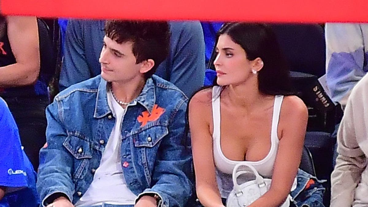 Timothée Chalamet and Kylie Jenner seated at Madison Square Garden during NBA Finals game.
