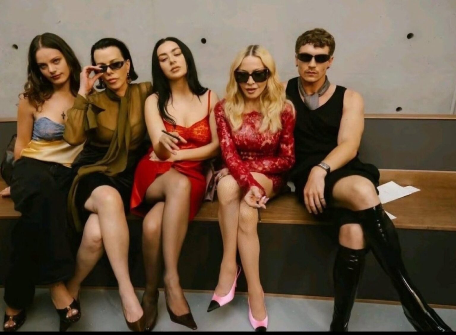 Madonna, Connor Storrie, Charli XCX, Debi Mazar and Evelina Corcos at the Saint Laurent Men’s Summer 27 show in Paris (June 23, 2026)