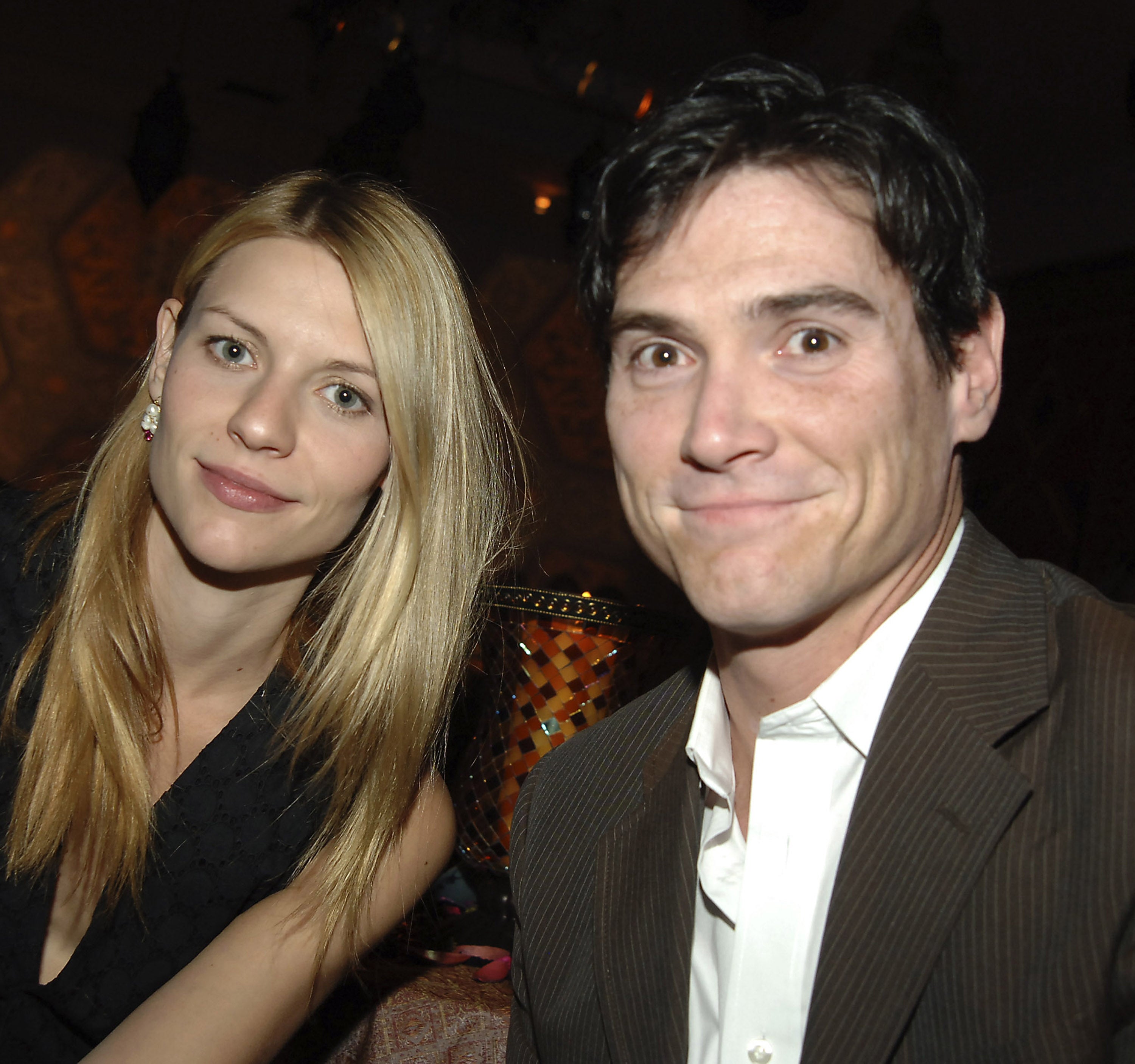 Claire Danes and Billy Crudup sit beside each other and smile