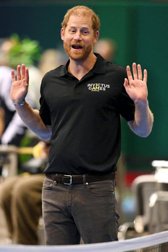 prince harry with hands up 