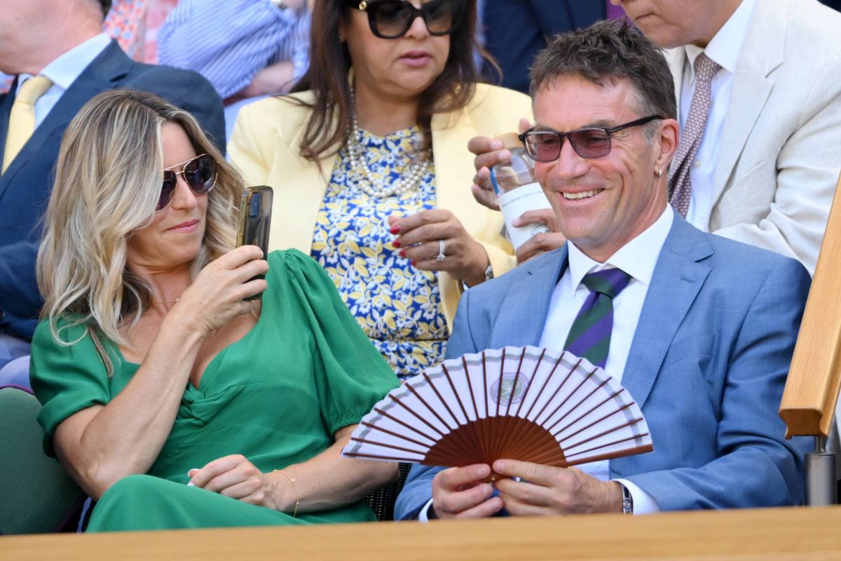 Charlotte Hodson and Pat Cash  attend day twelve of the Wimbledon Tennis Championships at the All England Lawn Tennis and Croquet Club at All England Lawn Tennis and Croquet Club