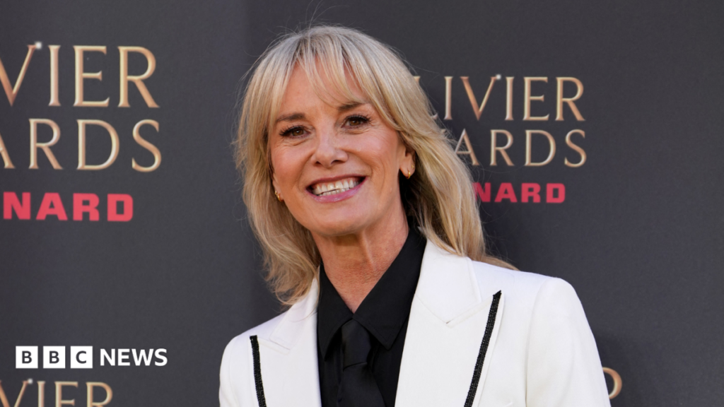 Outhwaite explains her ‘tradwife’ character in Abigail’s Party Tamzin Outhwaite smiling for the cameras in a white blazer. She is stood beside a photo board with the logo of the Olivier Awards.