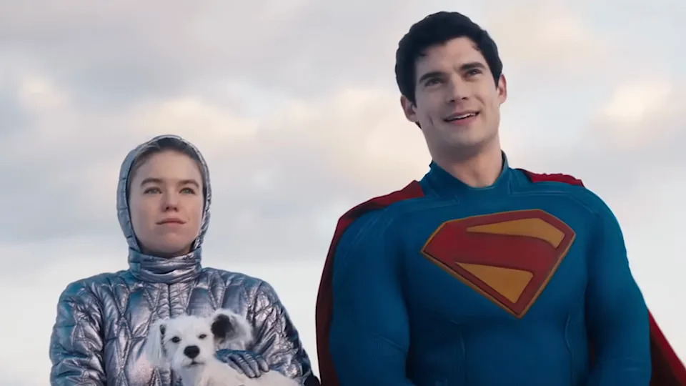 Superman standing with Kara and Krypto in snow looking at Fortress of Solitude in Supergirl