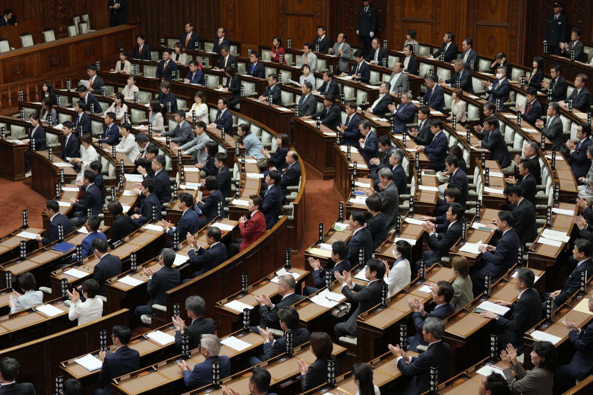 Members of Japan’s Upper House react after passing a bill to revise the imperial house law during its plenary session in Tokyo on July 17, 2026. Photo: AP