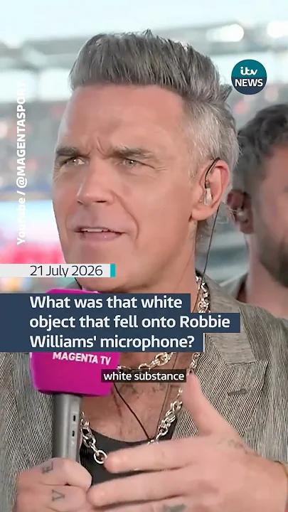 What was that white object that fell onto Robbie Williams' microphone? – YouTube What was that white object that fell onto Robbie Williams' microphone? - YouTube