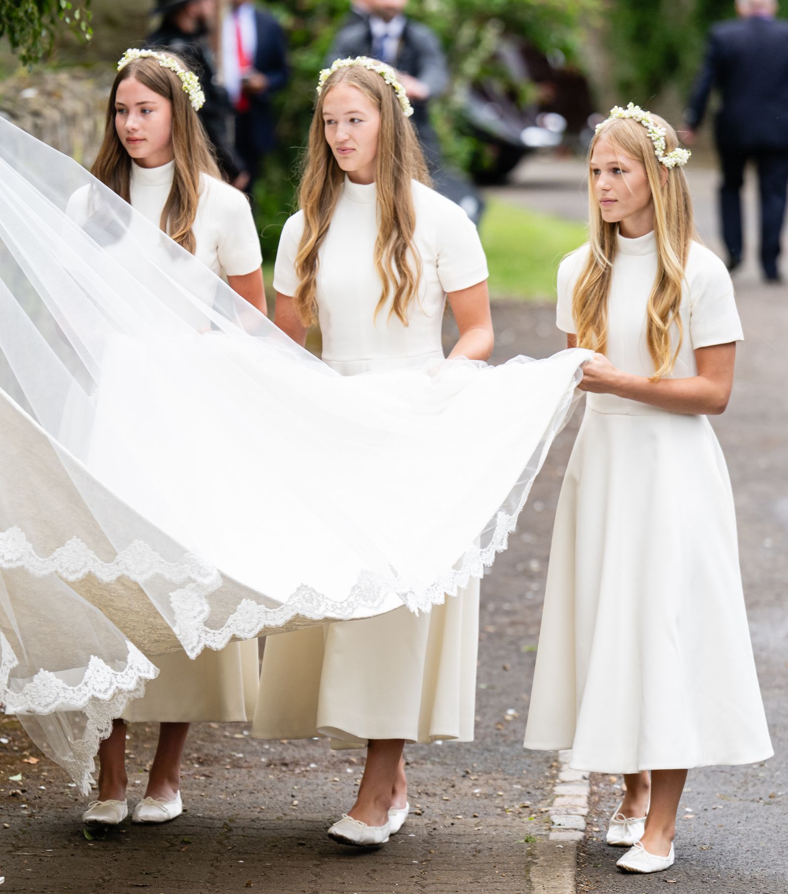 Image may contain Person Clothing Dress Fashion Formal Wear Gown Wedding Wedding Gown Adult and Bridesmaid