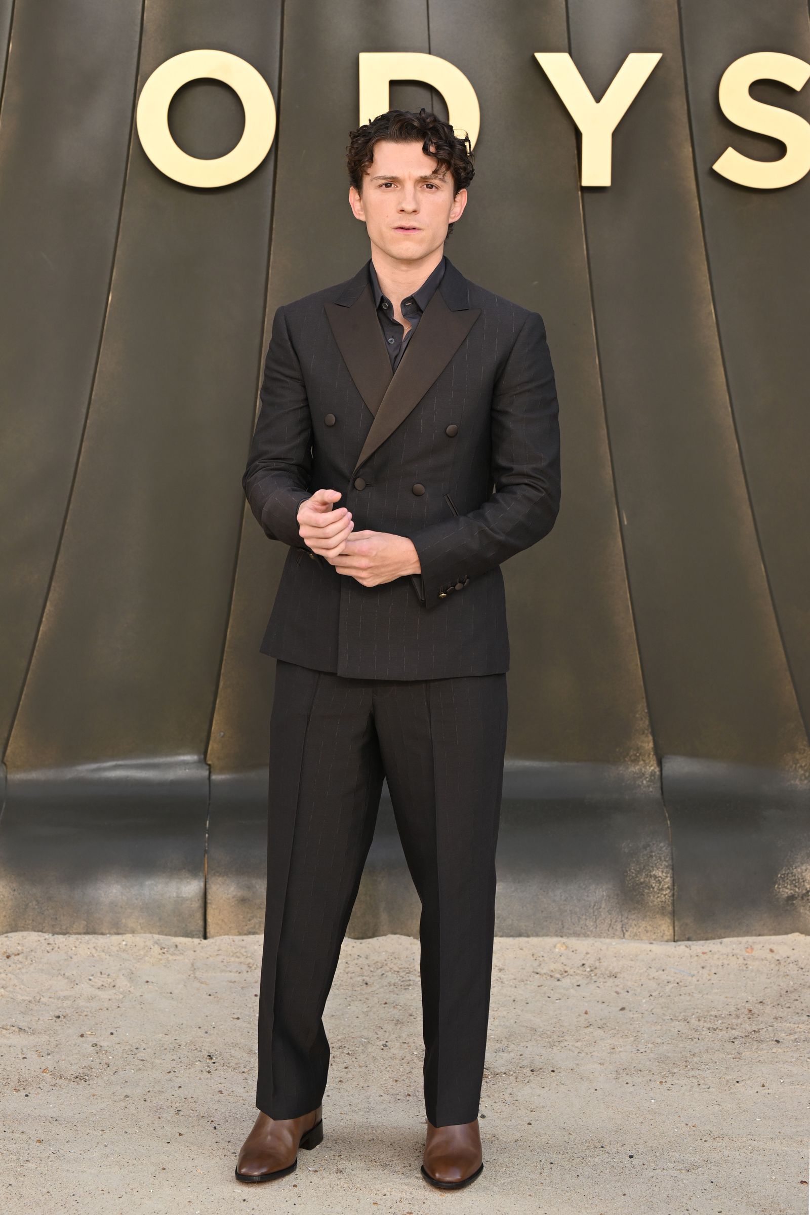 Image may contain Tom Holland Clothing Formal Wear Suit Blazer Coat Jacket Tuxedo Adult and Person